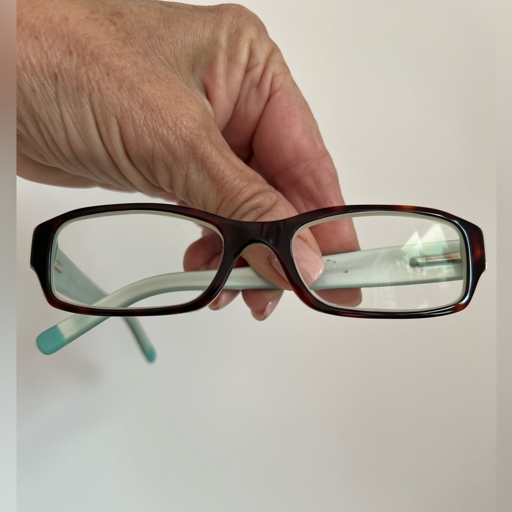 DKNY women’s glass frame. Tortoiseshell outside and light aqua pearl inside
